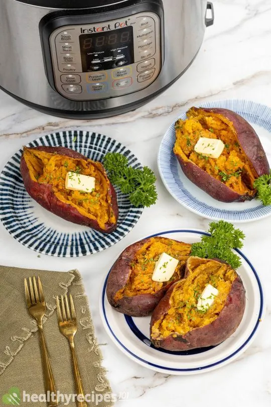 4 low sodium instant pot sweet potatoes  displayed on different color plates on a marble counter beside an instant pot. 