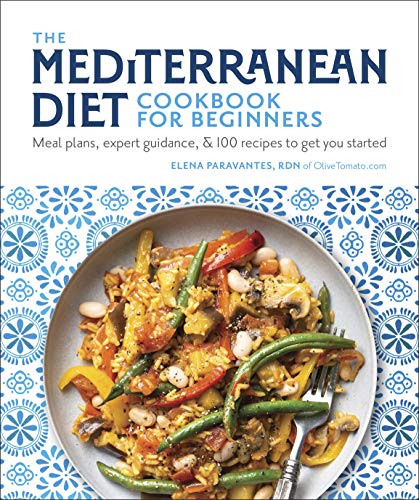 Mediterranean diet plant based cookbook cover on a blue and white background there is a white plate full of vegetables and pasta.