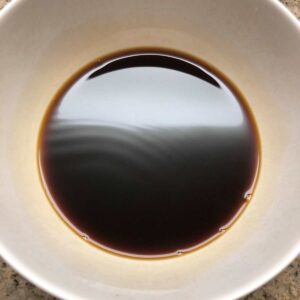 Black coffee with hot water in a white mug.