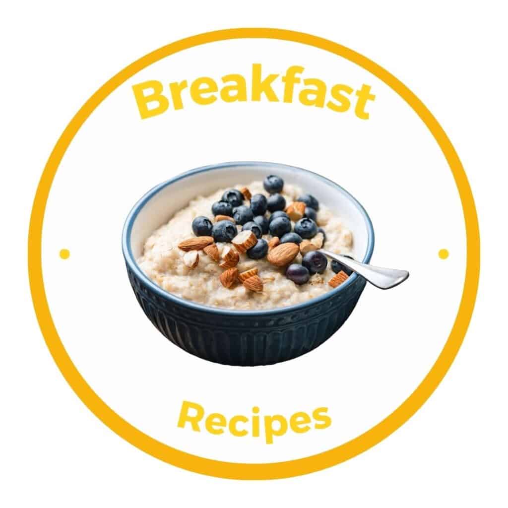 Yellow circle button with link to breakfast recipe category and a picture of blue bowl full of oatmeal topped with blueberries and almonds.