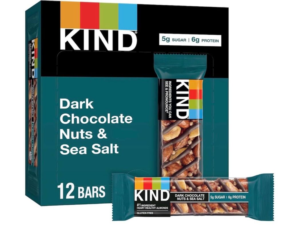 A box of dark chocolate nuts and sea salt KIND bars, with a bar pictured in front of the box. 