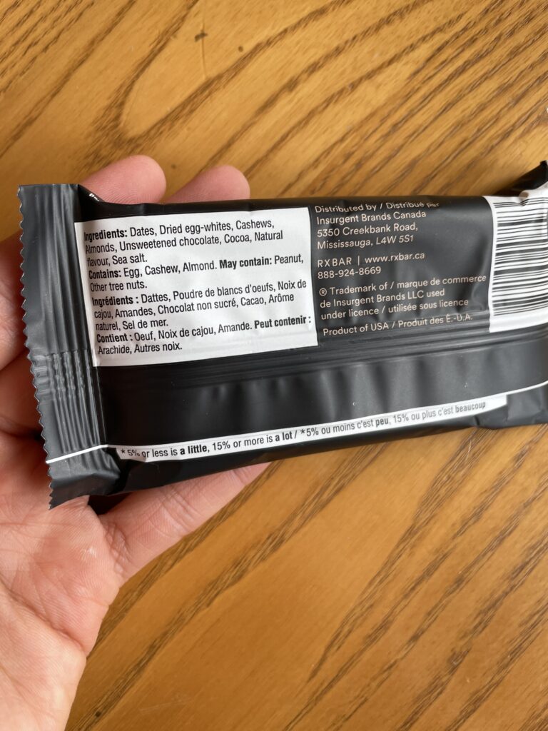 RX ingredient list low sodium protein bar label on a wood background.