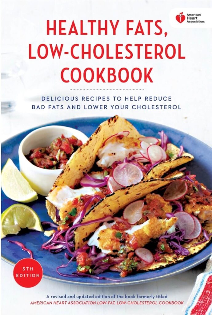 A low cholesterol cookbook with fish tacos on the cover. The title reads "Healthy Fats, Low-Cholesterol Cookbook"
