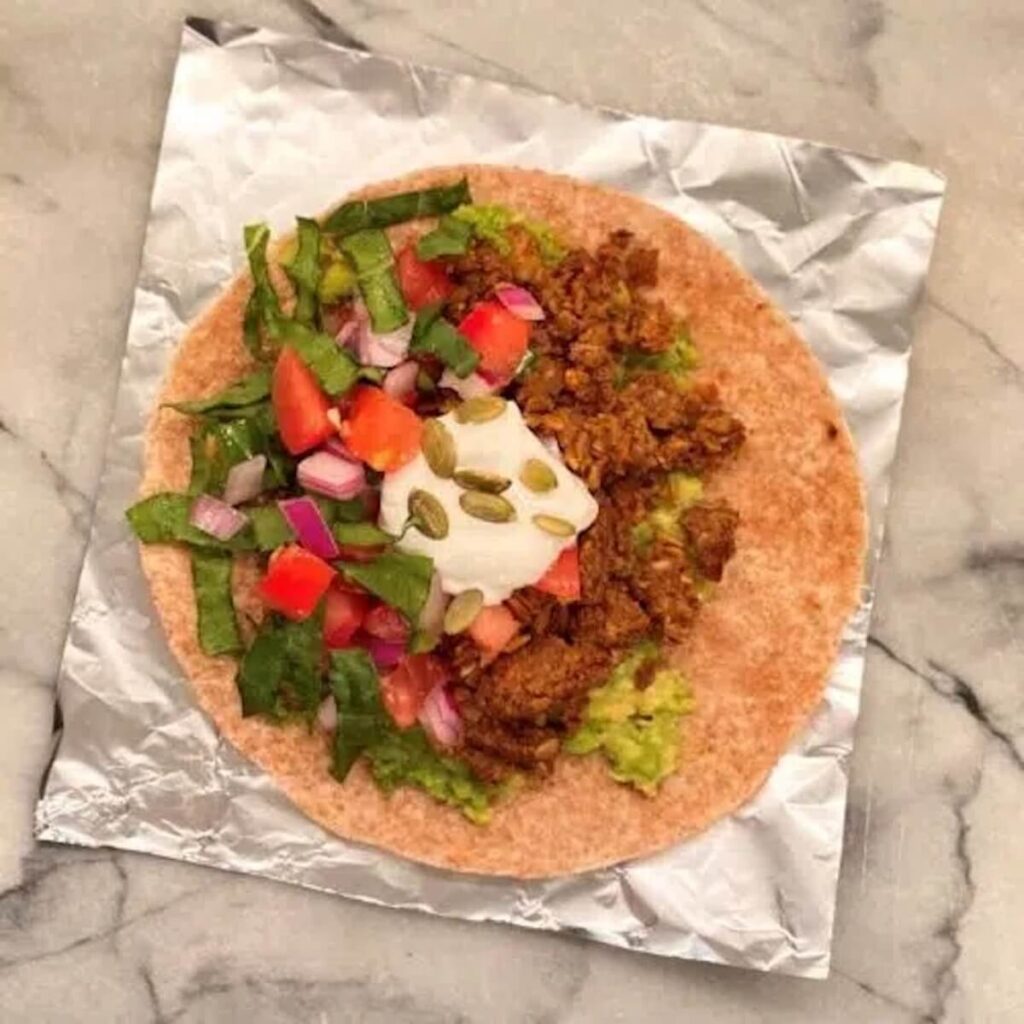 Lentil Burrito on top of a piece of foil. 