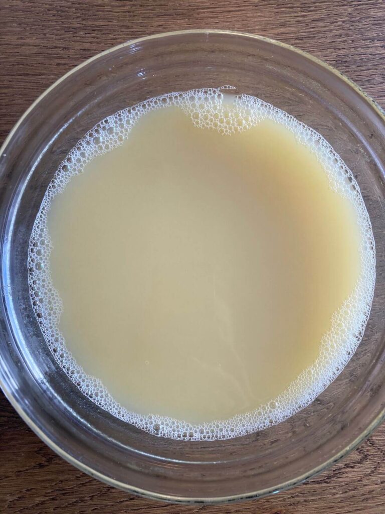 Final image of sieved chickpea milk in a glass bowl. 