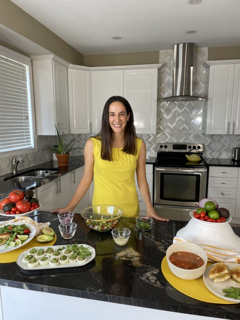 An image of Veronica, The Heart Dietitian photographed with guacamole recipes.